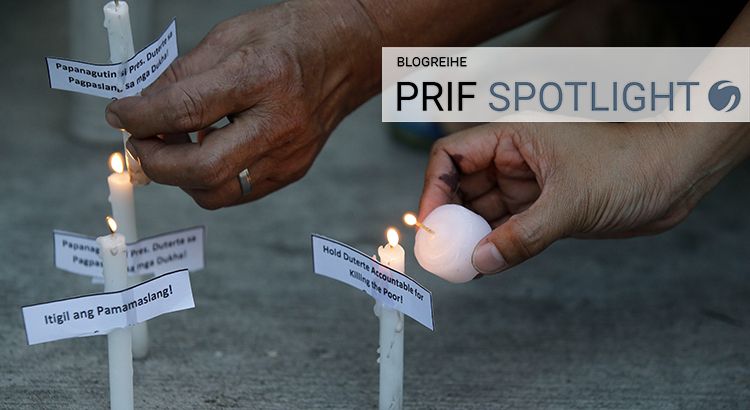 Two hands lighting three white candles. Attached to the candles are small notes; one claiming "Hold Duterte Accountable for Killing the Poor!".