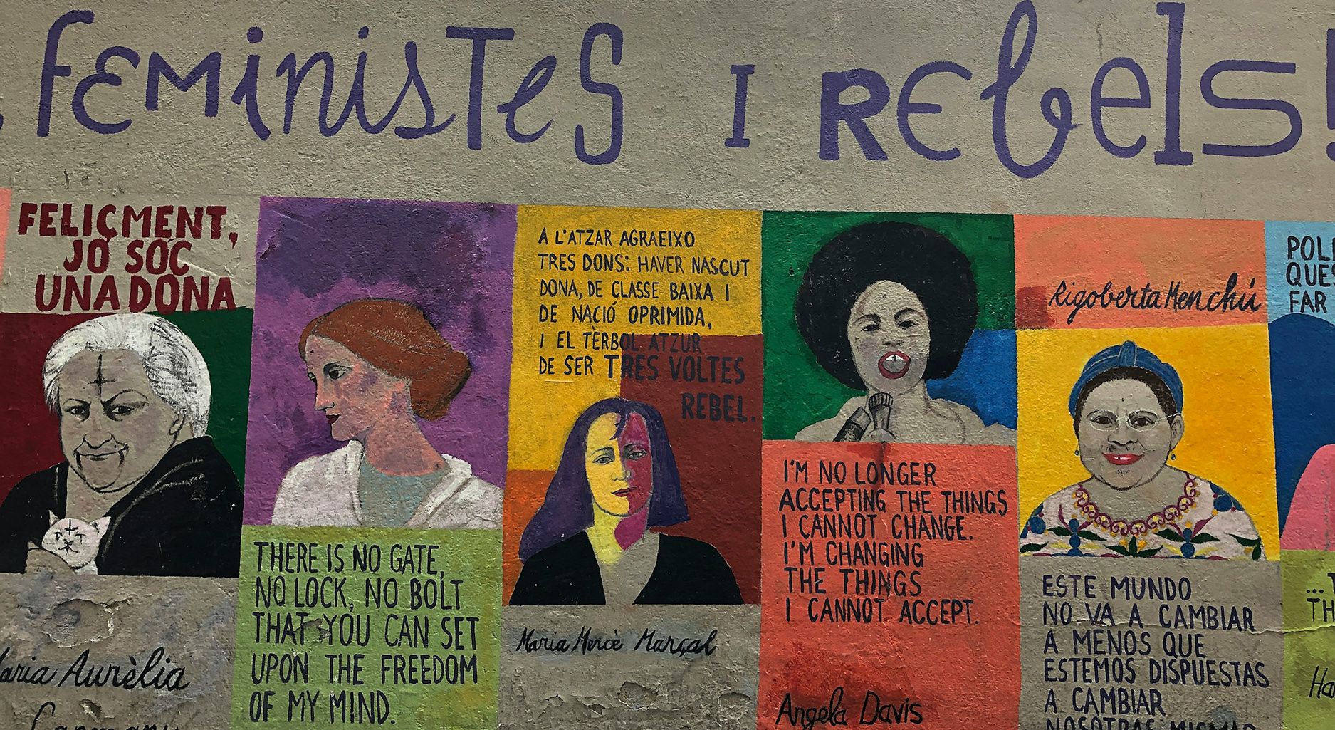 A colourful mural with five pictures of famous women like Angela Davis, Virginia Woolf or Rigoberta Menchi and quotes. Above, the headline reads Feministes I Rebels.
