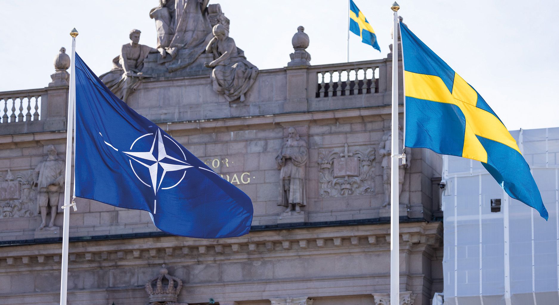 A Nato Flag and a Swedish Flag