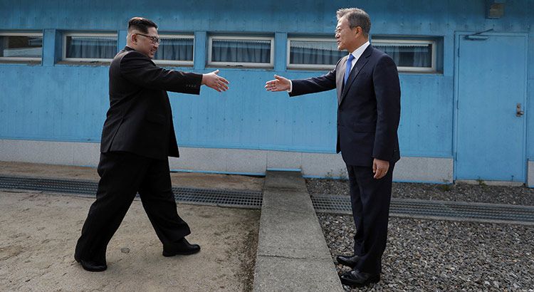 North Korean leader Kim Jong Un, left, prepares to shake hands with South Korean President Moon Jae-in