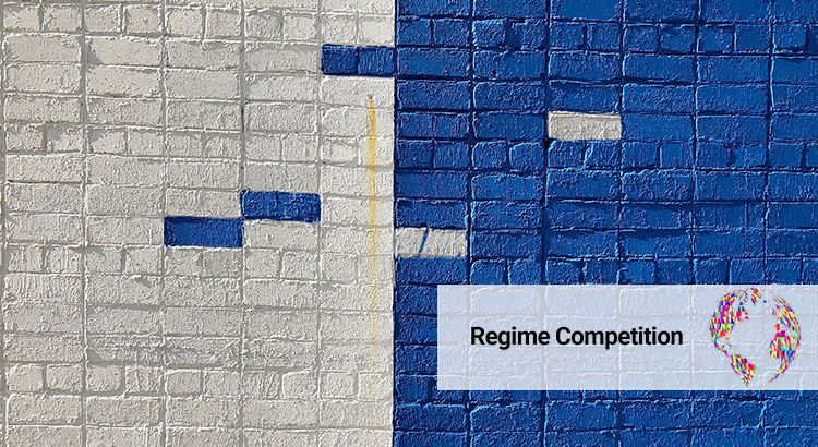 Wall with bricks, half is painted white, the other half is painted blue, but on both sides a few bricks have the opposite color.