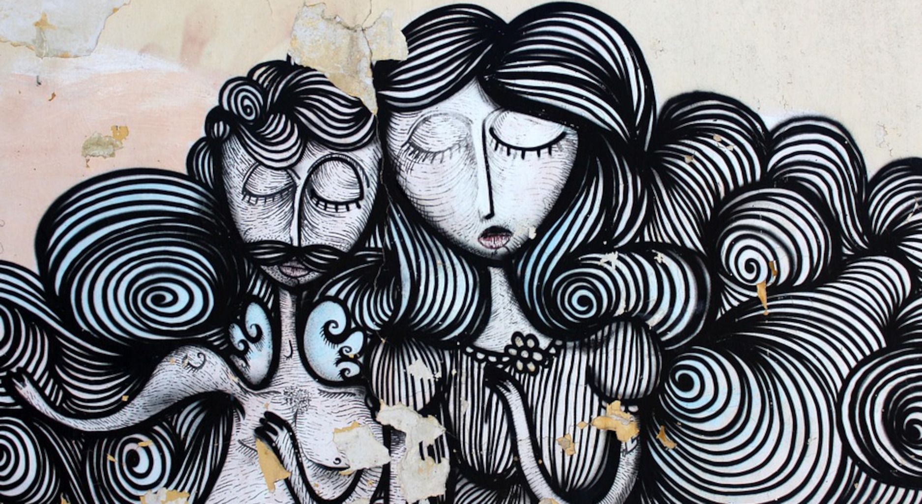 Mural of woman and man in black and white with wavy shapes.