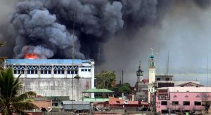 A building in Marawi, Philippines is set ablaze by airstrikes carried out by the Philippine Air Force