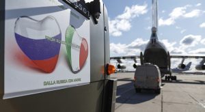 In this Sunday, March 22, 2020, photo supplied by Russian Defense Ministry Press Service, military trucks load onto an Il-76 cargo plane in Chkalovsky military airport outside Moscow, Russia. Nine hulking Il-76 cargo planes are being loaded at the Chkalovsky military airport in Moscow as Russia prepares to send medical personnel and supplies to Italy to help the country's efforts against the coronavirus. The mission include eight mobile medical teams along with medical equipment and aerosol disinfection trucks is to begin Sunday, one day after Russian President Vladimir Putin offered the aid in a telephone conversation with Italian Prime Minister Giuseppe Conte, whose country has confirmed more than 53,000 coronavirus cases and over 4,800 deaths. (Alexei Yereshko, Russian Defense Ministry Press Service via AP) |