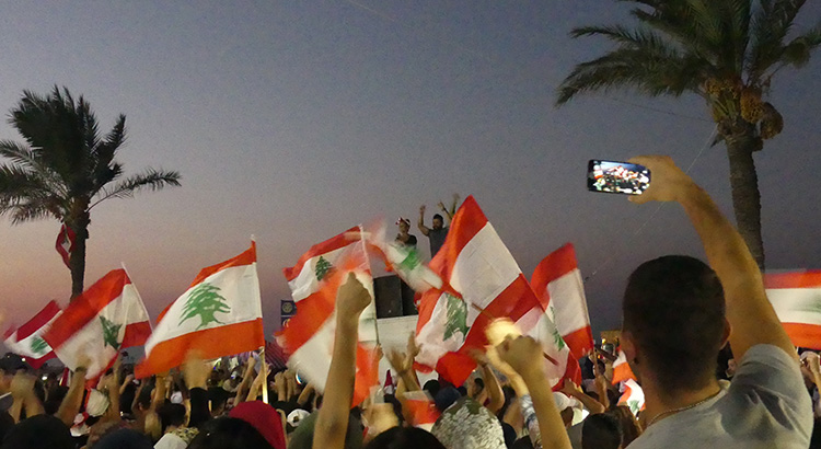Protestors in Tyre/Sour, Southern Lebanon, cheering to a female singer during nonsectarian demonstrations against government corruption and austerity measures that started across the country on October 17th, 2019.