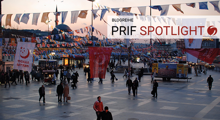 Public square in Istanbul with election banners signifiyng different political parties.