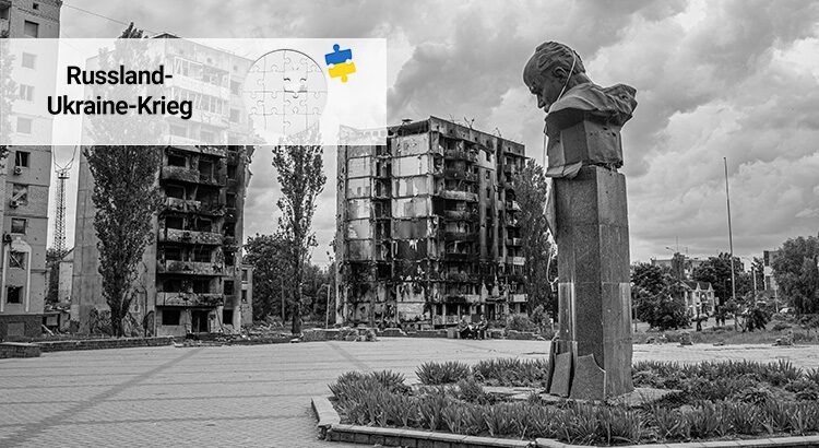 Bombed homes in Borodyanka, Ukraine, and a damaged statue.