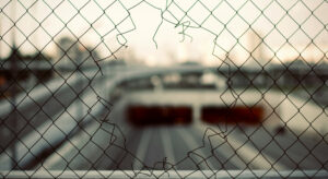 A hole in a wire mesh fence