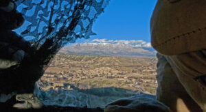 View through a curtain onto a mountainous landscape