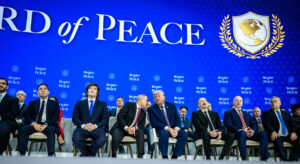 Members of the Board of Peace on a stage.
